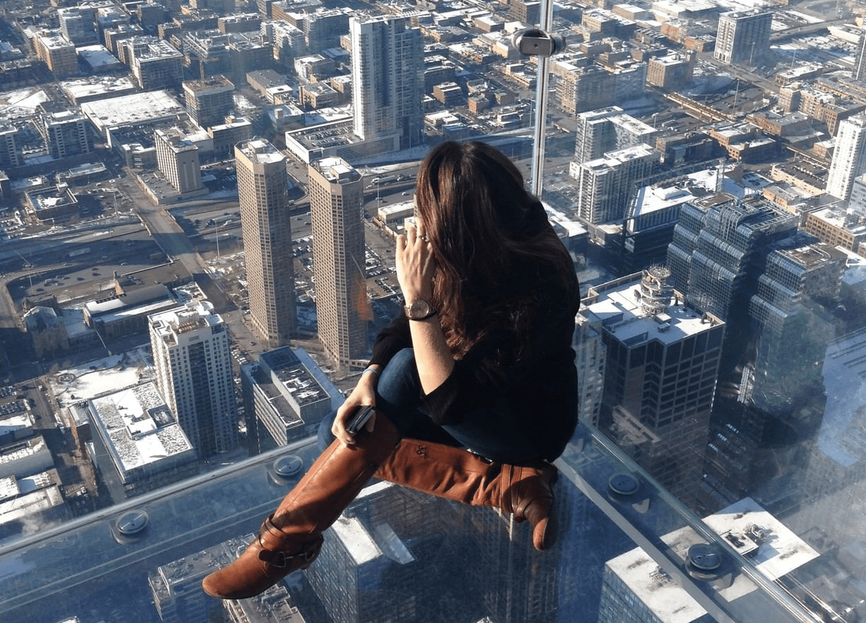 Woman views Chicago from Skydeck.
