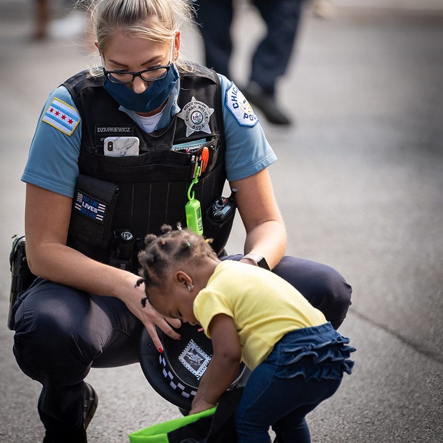 Chicago Police officer with child.