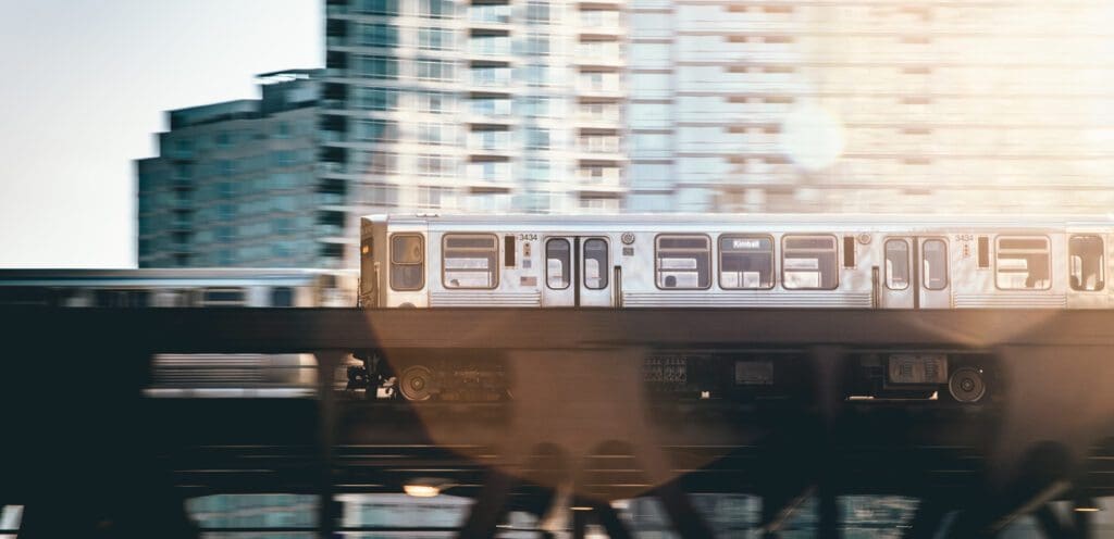 Chicago CTA elevated train with high-rise buildings.
